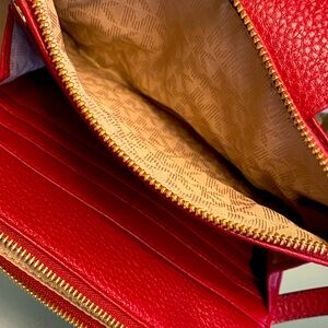 Michael Kors Designer Fulton Crossbody Bag in red.